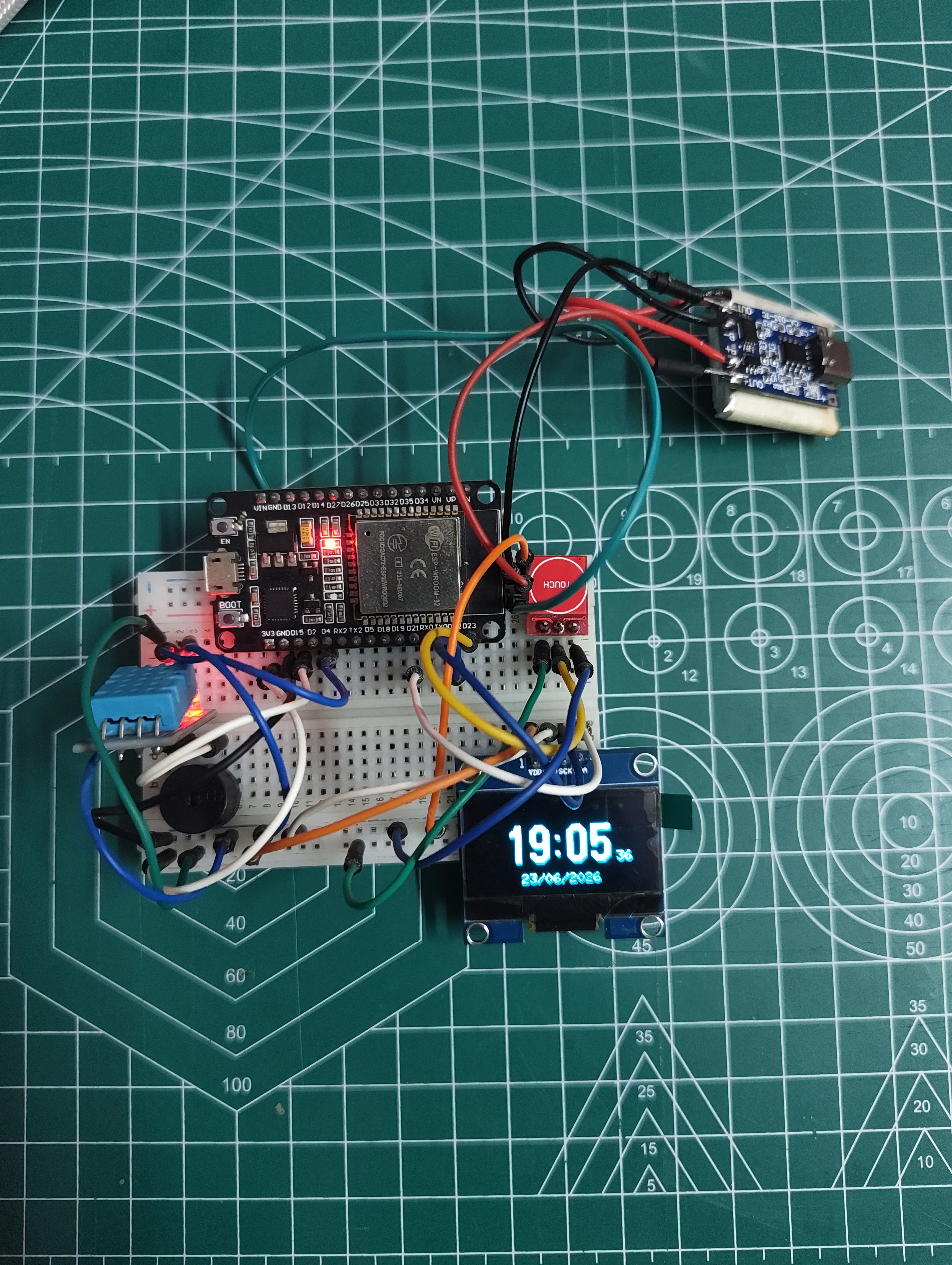 OpenClock-C3 hardware setup showing ESP32-C3 Super Mini, SH1106 OLED, buzzer and touch sensor