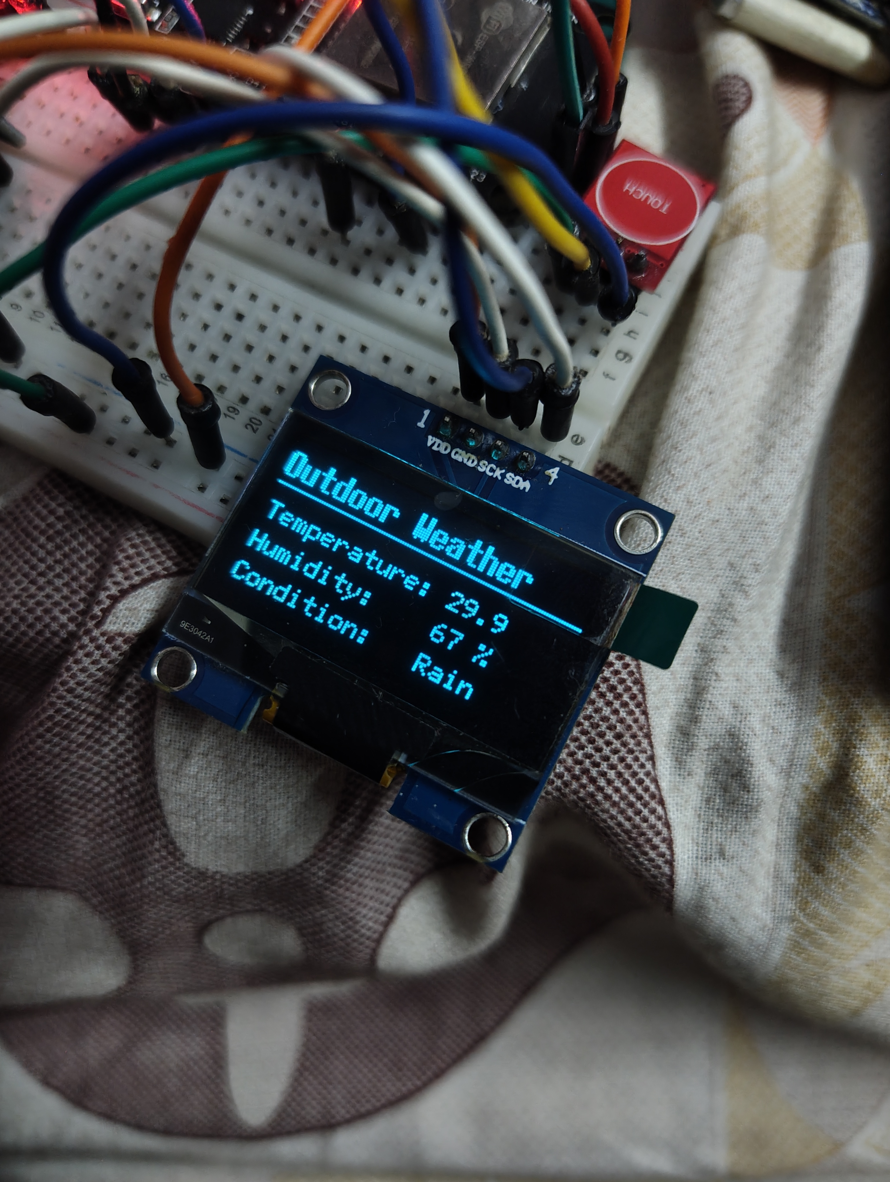 OpenClock-C3 showing the weather display face with temperature and conditions